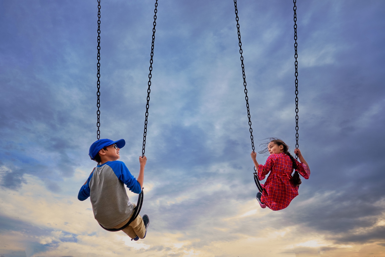 Children on swings in Fort McMurray Wood Buffalo